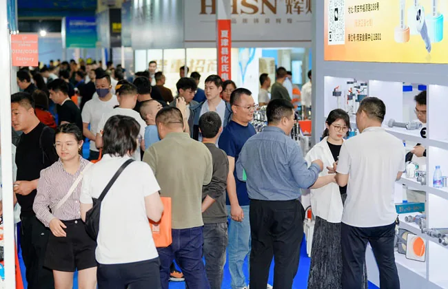 Modern trade show exhibition hall with busy attendees